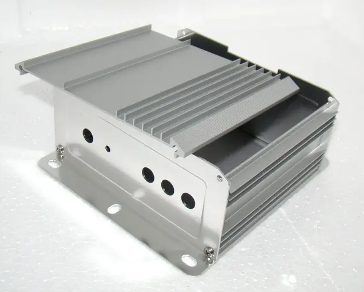 Extruded aluminium enclosure with cooling fins, end plates, and mounting flanges