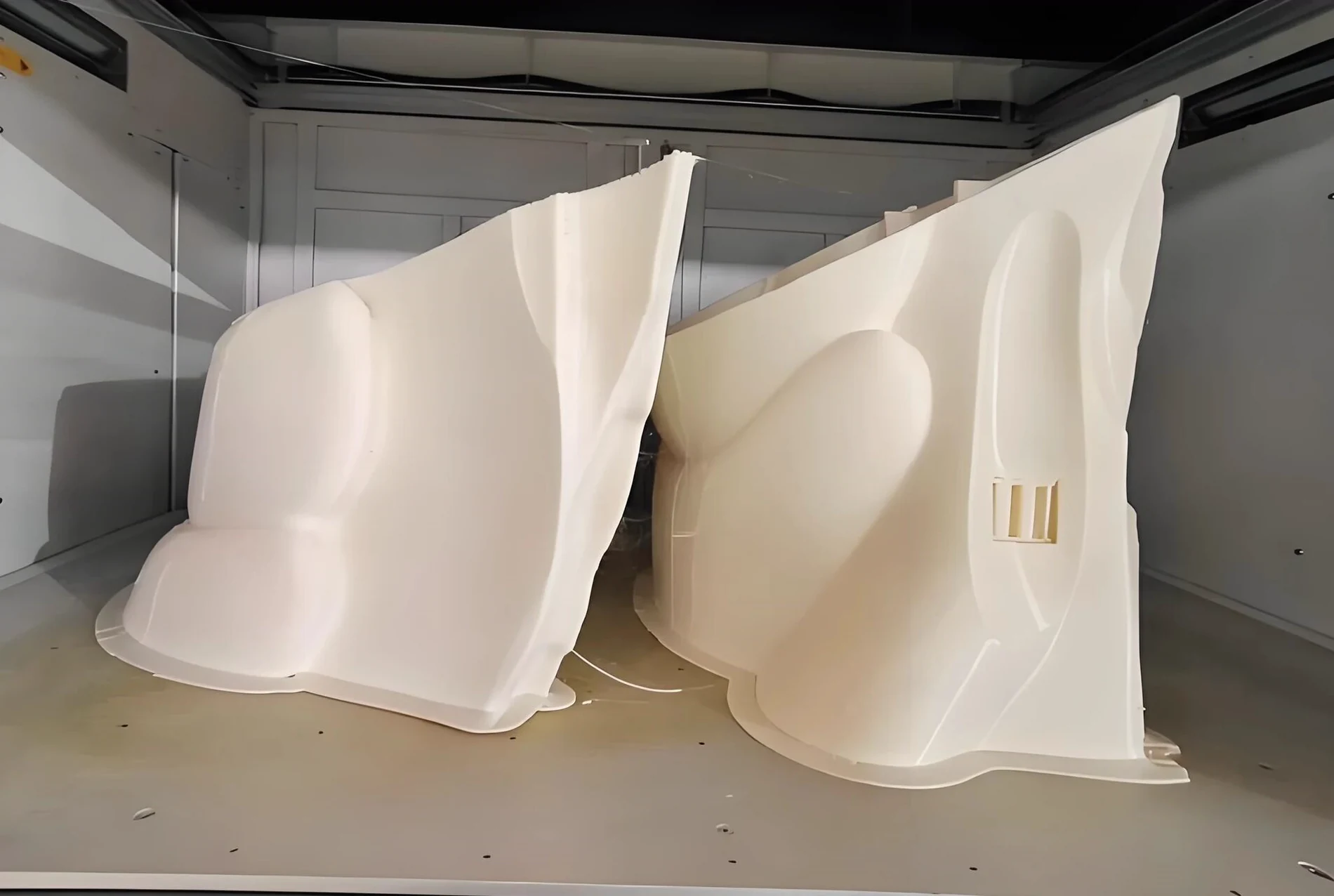 Large thermoformed plastic enclosure shells before trimming and assembly